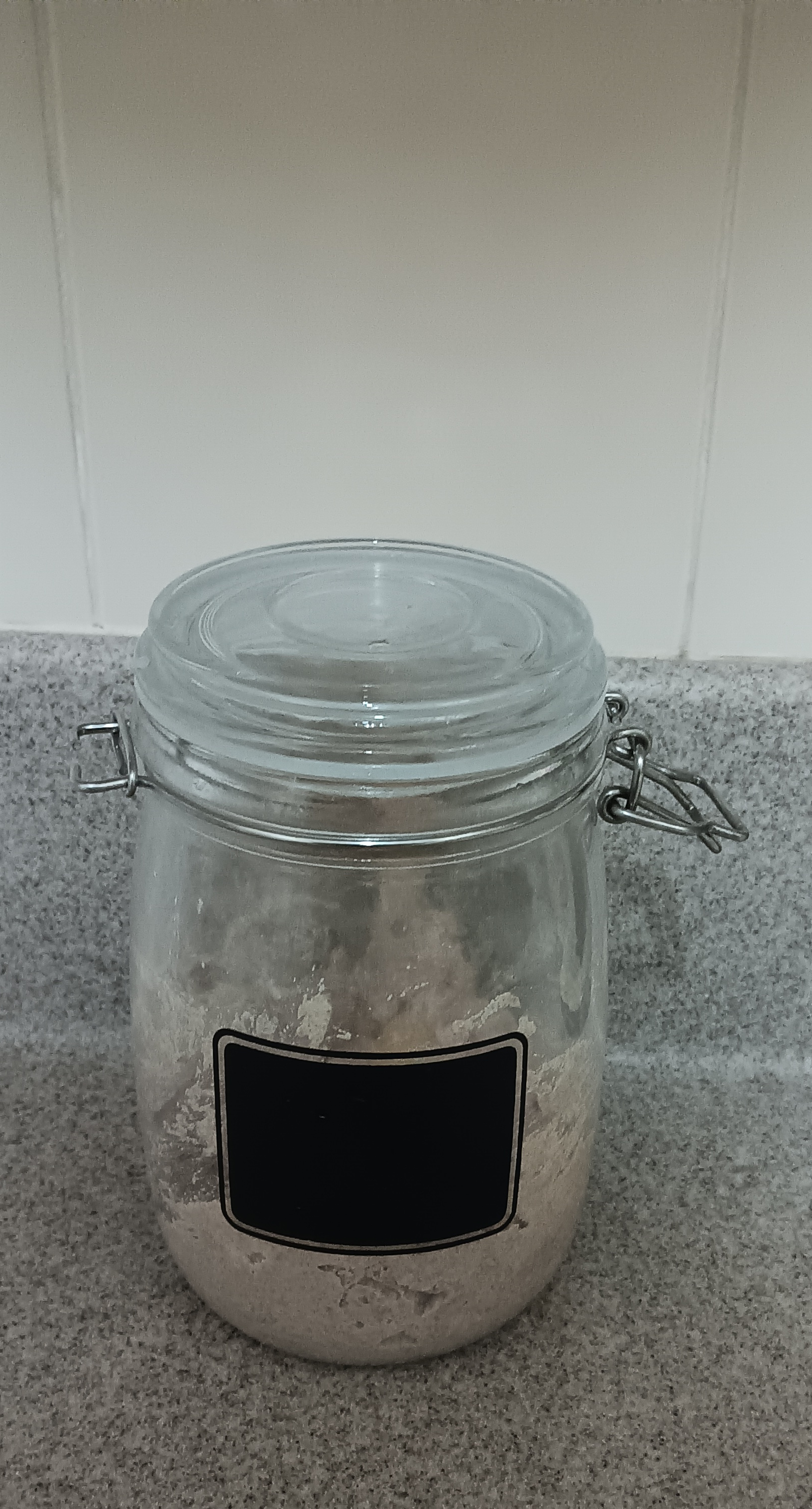 Image of a flip-top jar containing sourdough starter